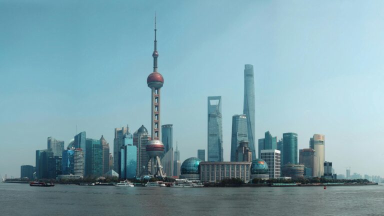 Breathtaking view of Shanghai skyline featuring iconic landmarks like the Oriental Pearl Tower and Shanghai Tower.