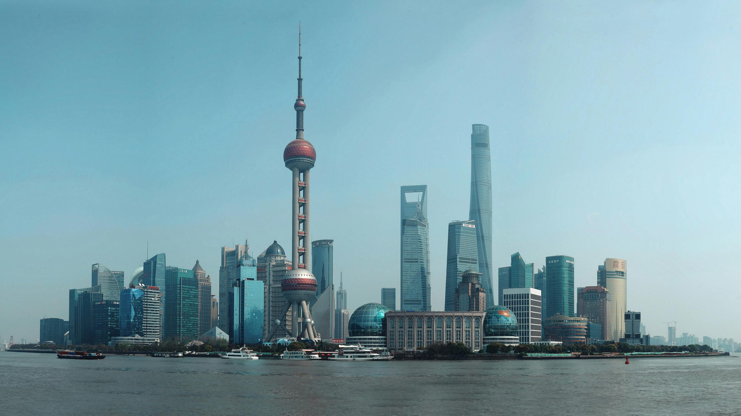 Breathtaking view of Shanghai skyline featuring iconic landmarks like the Oriental Pearl Tower and Shanghai Tower.